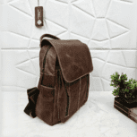 Full grain brown leather backpack with a stylish and minimalist design.
