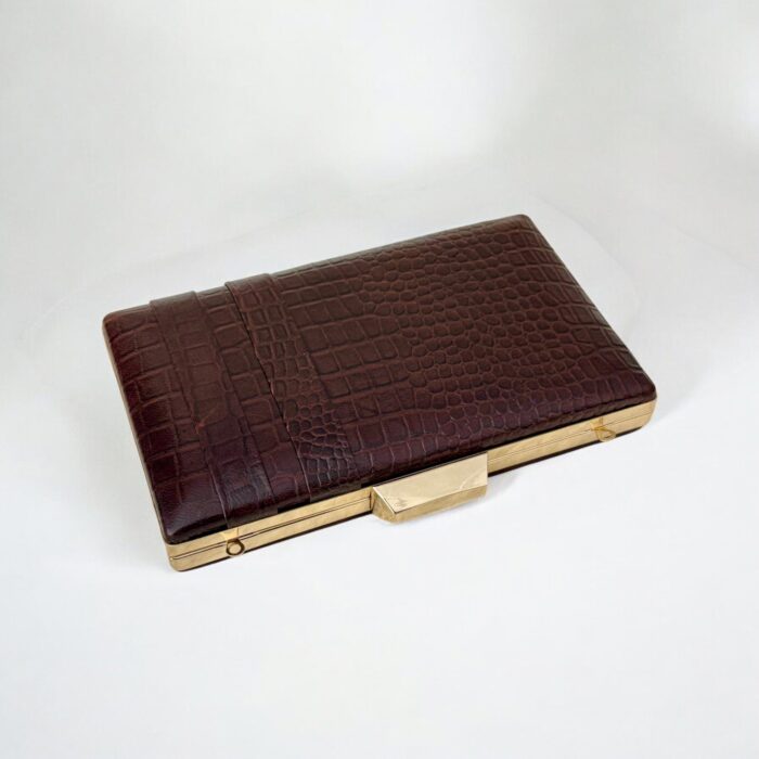 Luxurious brown croc-embossed leather clutch with gold chain strap