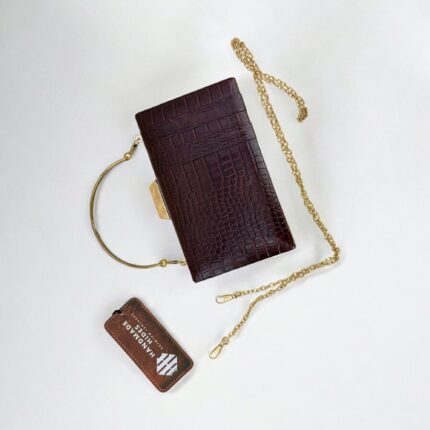 Luxurious brown croc-embossed leather clutch with gold chain strap