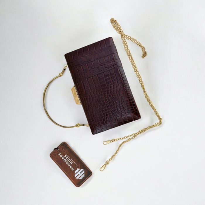 Luxurious brown croc-embossed leather clutch with gold chain strap
