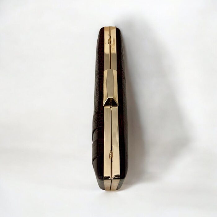 Luxurious brown croc-embossed leather clutch with gold chain strap