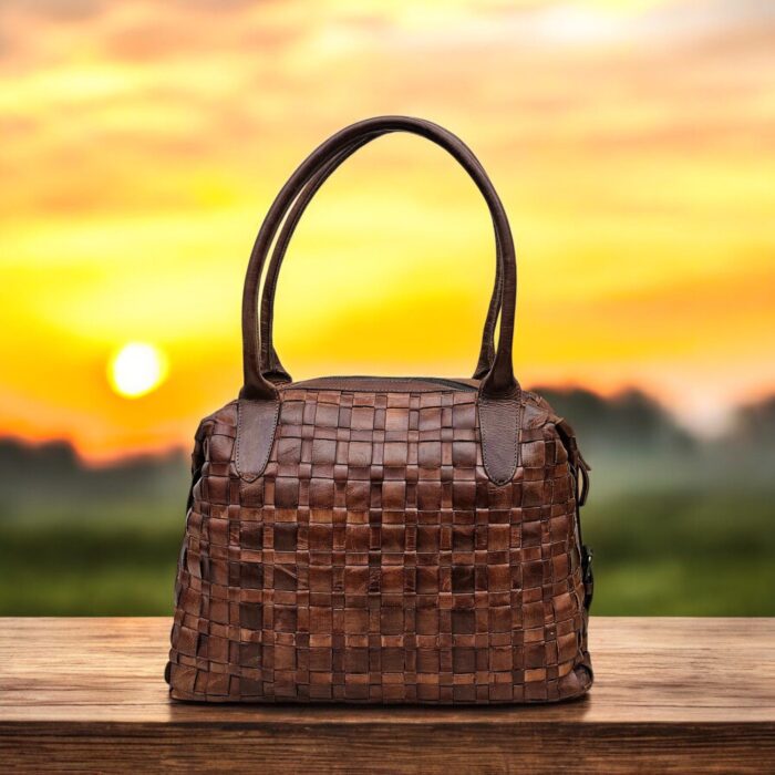 Handmade brown woven leather handbag with a spacious interior, secure zipper closure, and premium full-grain leather construction for a timeless look