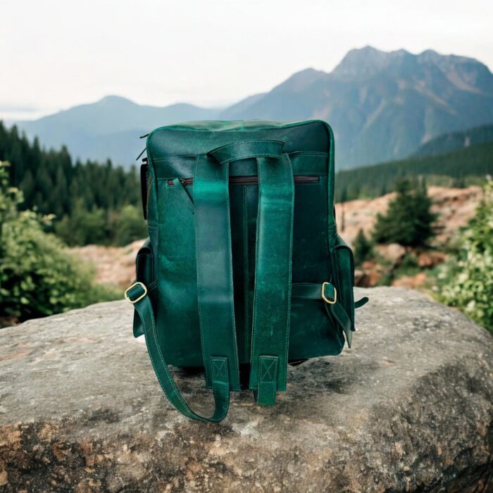 Handmade Green Leather Backpack – Full-grain leather, vintage design, spacious main compartment, multiple pockets, and adjustable padded straps. Fits a 15-inch laptop, perfect for work, travel, or daily use. Unisex eco-friendly leather bag with durable craftsmanship.