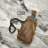 Handmade brown leather sling bag with adjustable strap
