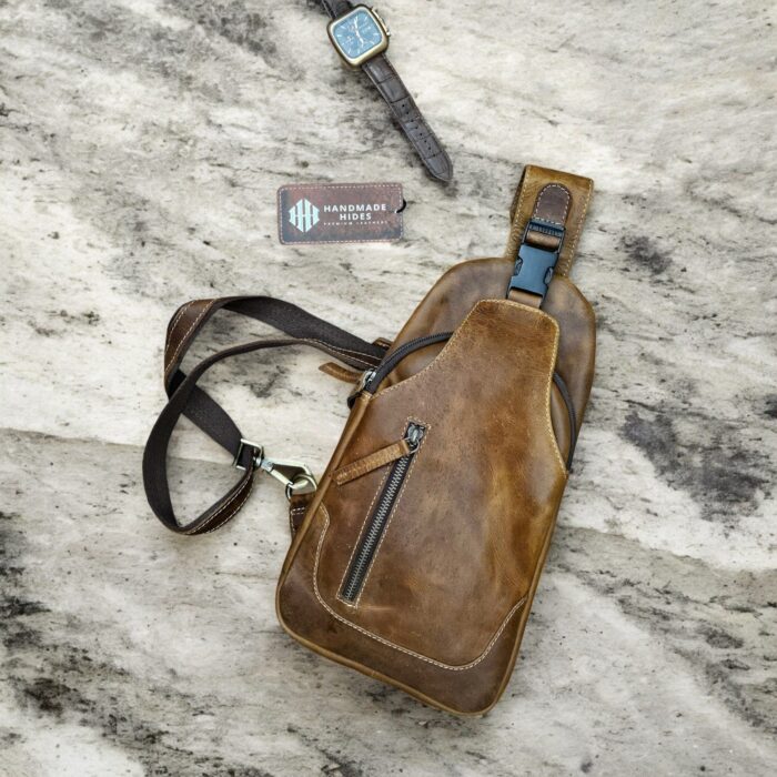 Handmade brown leather sling bag with adjustable strap