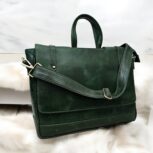 Handmade Green Leather Laptop Bag displayed with office essentials