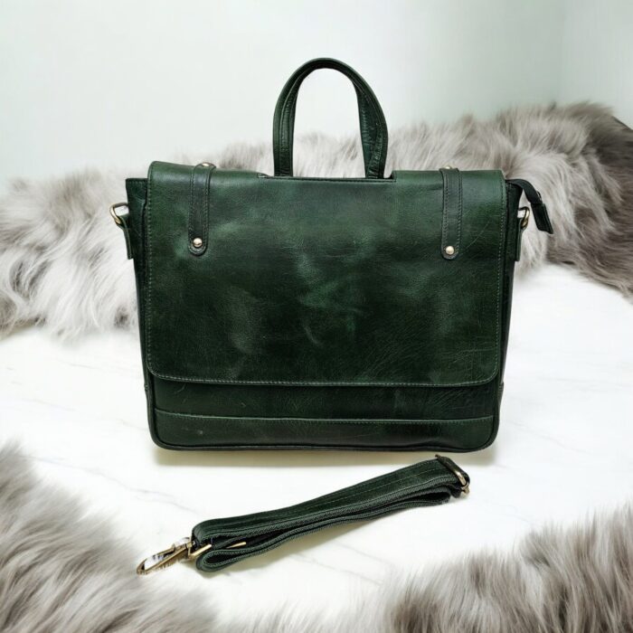Handmade Green Leather Laptop Bag displayed with office essentials