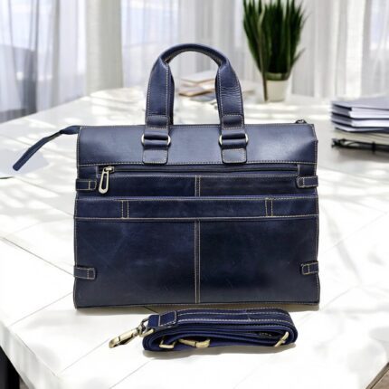 Premium handcrafted navy blue leather briefcase with adjustable shoulder strap and spacious compartments