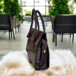 dark brown crocodile-embossed leather handbag with a structured silhouette.