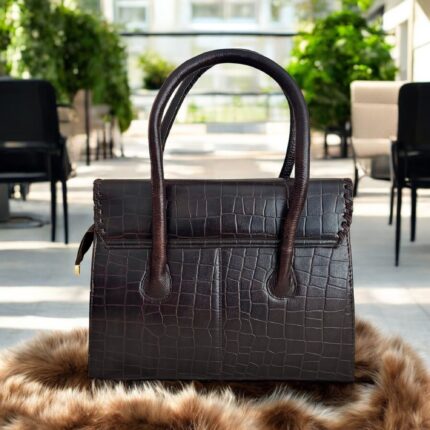 dark brown crocodile-embossed leather handbag with a structured silhouette.