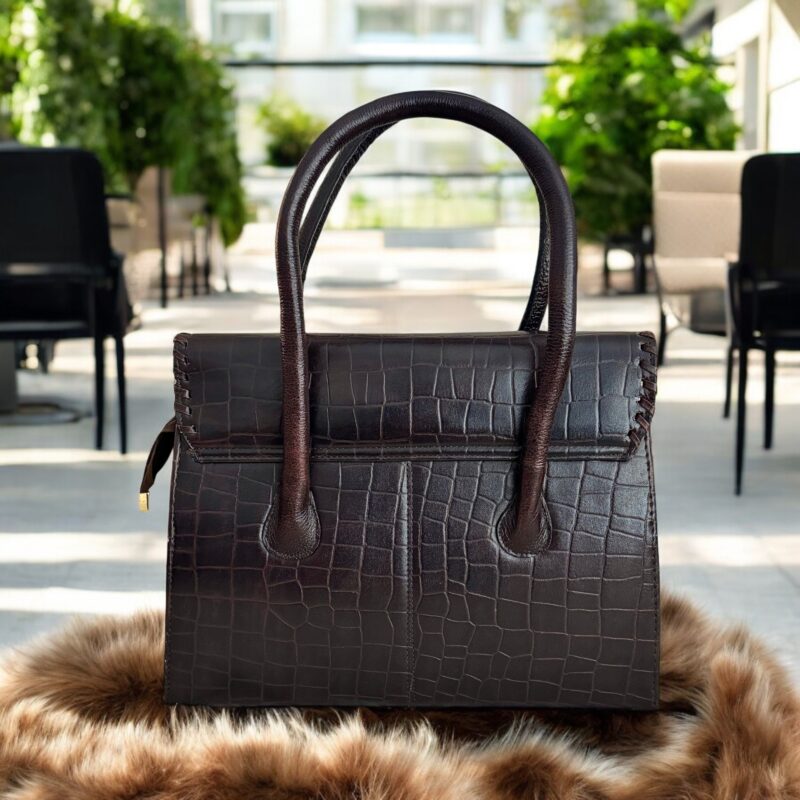 dark brown crocodile-embossed leather handbag with a structured silhouette.