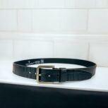 Black crocodile-embossed leather belt for men, luxury leather belt with polished metal buckle, premium croc-textured leather belt for formal and casual wear.