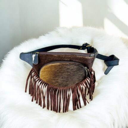 Handmade leather waist bag with boho fringe and hair-on detailing