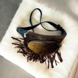 Handmade leather waist bag with boho fringe and hair-on detailing