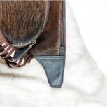 Handmade leather waist bag with boho fringe and hair-on detailing