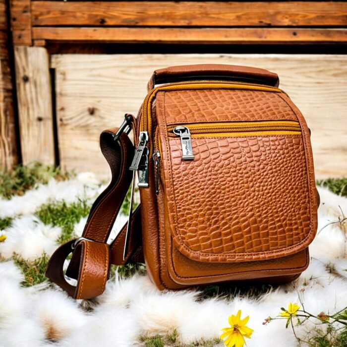 Handmade crocodile-embossed leather crossbody bag with a rich brown finish, adjustable strap, and multiple compartments for everyday essentials.