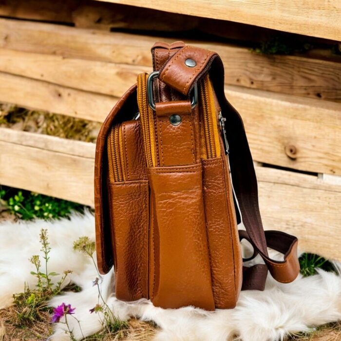 Handmade crocodile-embossed leather crossbody bag with a rich brown finish, adjustable strap, and multiple compartments for everyday essentials.
