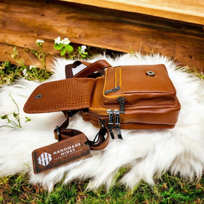Handmade crocodile-embossed leather crossbody bag with a rich brown finish, adjustable strap, and multiple compartments for everyday essentials.
