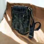Handcrafted genuine leather sling bag made from ethically sourced goat leather. Compact yet spacious crossbody bag with zippered pockets and adjustable strap. Unisex design, perfect for work, travel, or everyday use. Durable, stylish, and eco-friendly.
