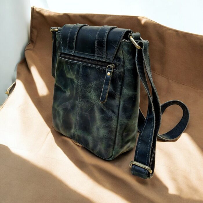 Handcrafted genuine leather sling bag made from ethically sourced goat leather. Compact yet spacious crossbody bag with zippered pockets and adjustable strap. Unisex design, perfect for work, travel, or everyday use. Durable, stylish, and eco-friendly.