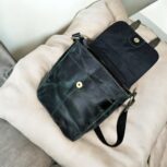 Handcrafted genuine leather sling bag made from ethically sourced goat leather. Compact yet spacious crossbody bag with zippered pockets and adjustable strap. Unisex design, perfect for work, travel, or everyday use. Durable, stylish, and eco-friendly.