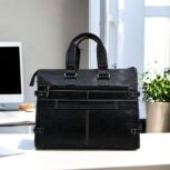 Premium black leather laptop bag with a sleek, professional design for business and travel.