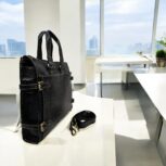Premium black leather laptop bag with a sleek, professional design for business and travel.