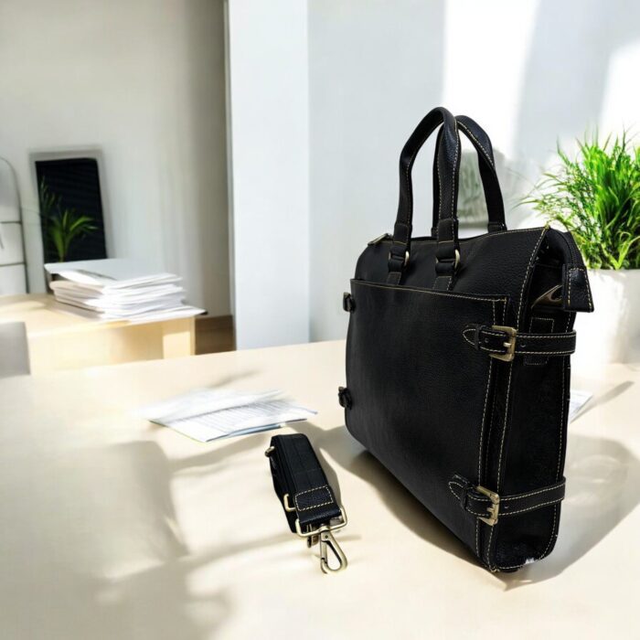 Premium black leather laptop bag with a sleek, professional design for business and travel.