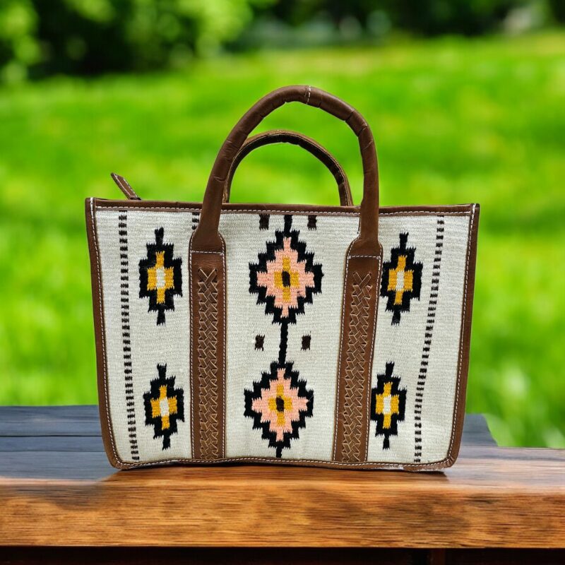 Handwoven wool and leather tote bag with Aztec geometric pattern in earthy tones