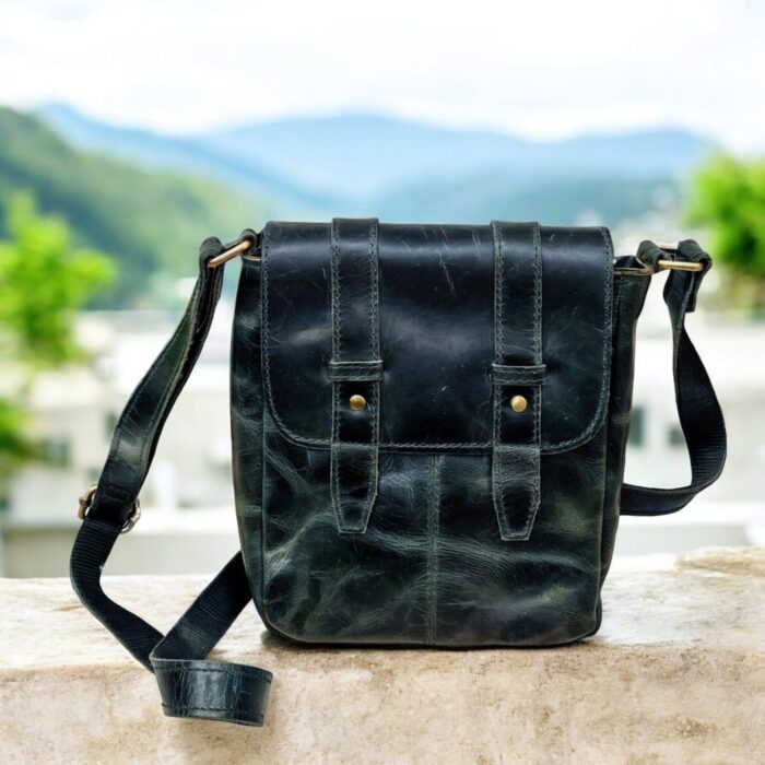 Handcrafted genuine leather sling bag made from ethically sourced goat leather. Compact yet spacious crossbody bag with zippered pockets and adjustable strap. Unisex design, perfect for work, travel, or everyday use. Durable, stylish, and eco-friendly.