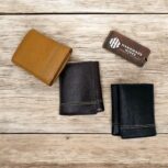 Handmade leather trifold wallet for men in brown, black, and tan with coin pocket and card slots