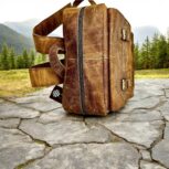 Handmade genuine leather backpack in a vintage brown finish, featuring adjustable straps and premium craftsmanship