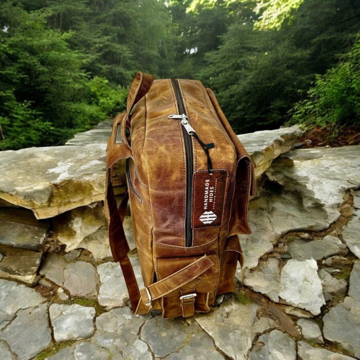 Handmade genuine leather backpack in a vintage brown finish, featuring adjustable straps and premium craftsmanship