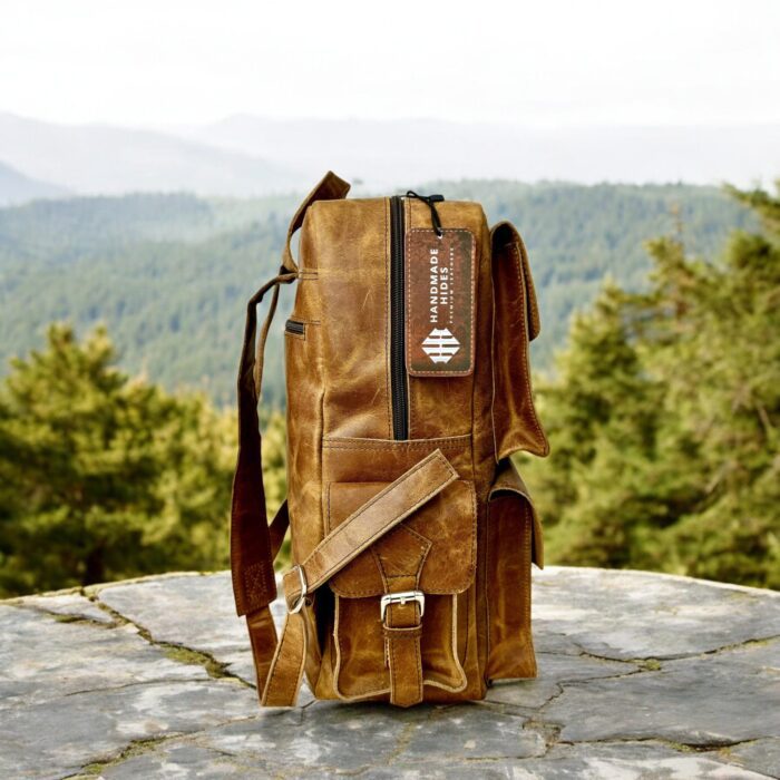Handmade genuine leather backpack in a vintage brown finish, featuring adjustable straps and premium craftsmanship