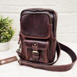 Handmade leather crossbody bag with vintage design and multiple pockets