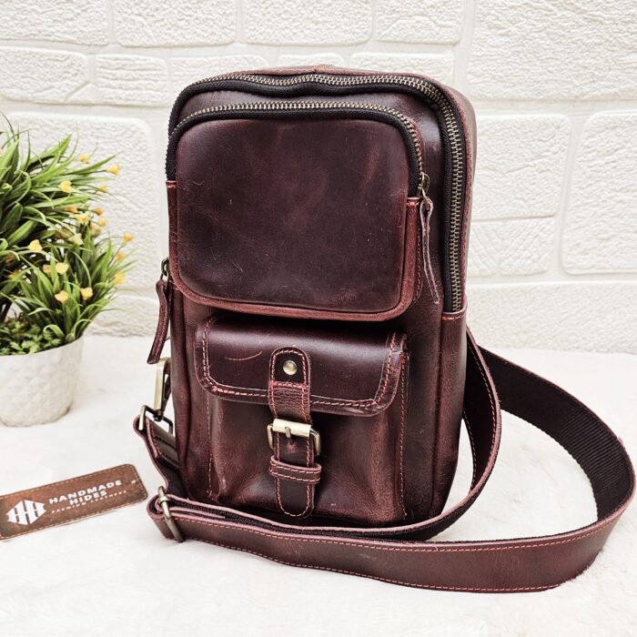 Handmade leather crossbody bag with vintage design and multiple pockets