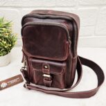 Handmade leather crossbody bag with vintage design and multiple pockets