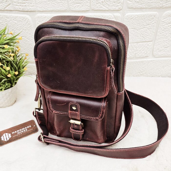 Handmade leather crossbody bag with vintage design and multiple pockets