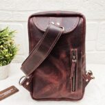 Handmade leather crossbody bag with vintage design and multiple pockets
