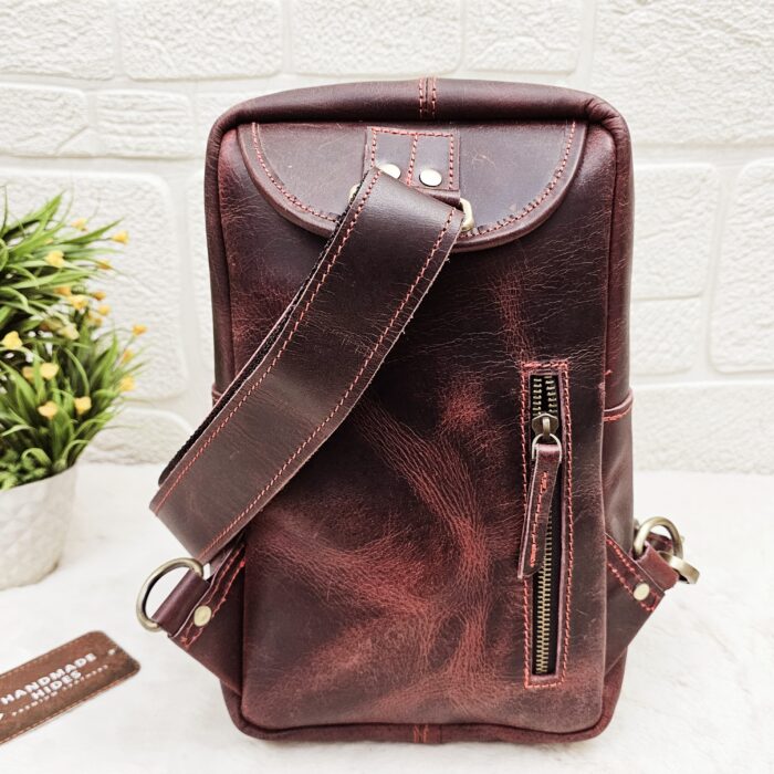 Handmade leather crossbody bag with vintage design and multiple pockets
