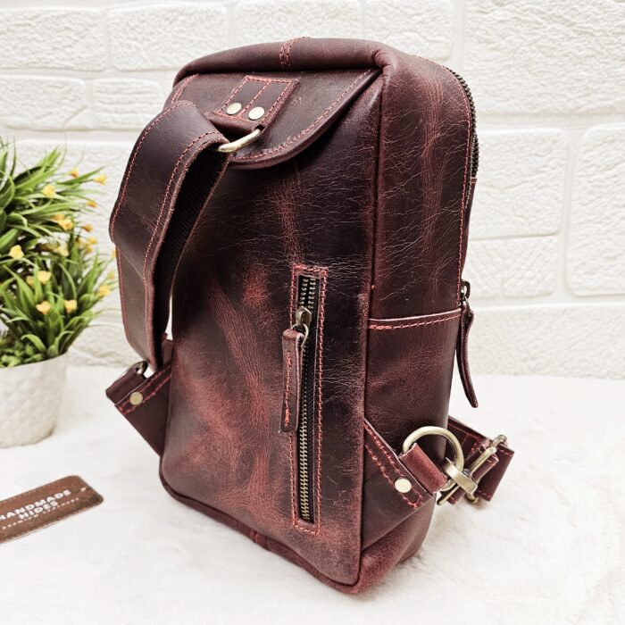 Handmade leather crossbody bag with vintage design and multiple pockets