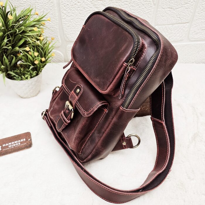 Handmade leather crossbody bag with vintage design and multiple pockets