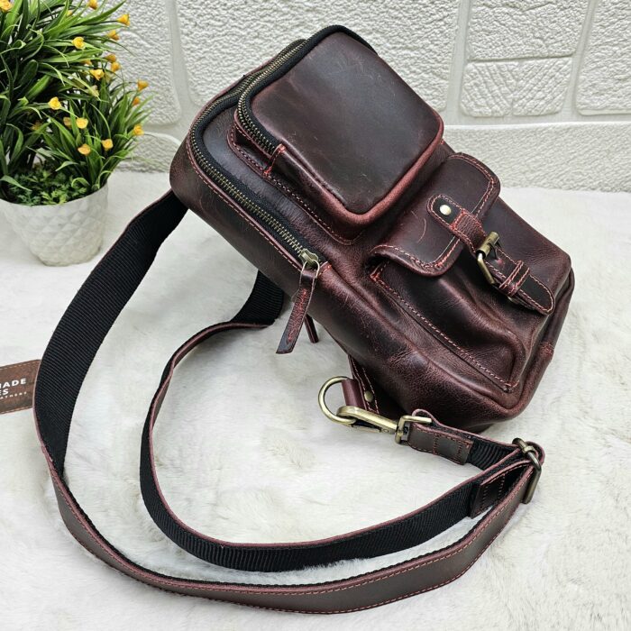 Handmade leather crossbody bag with vintage design and multiple pockets