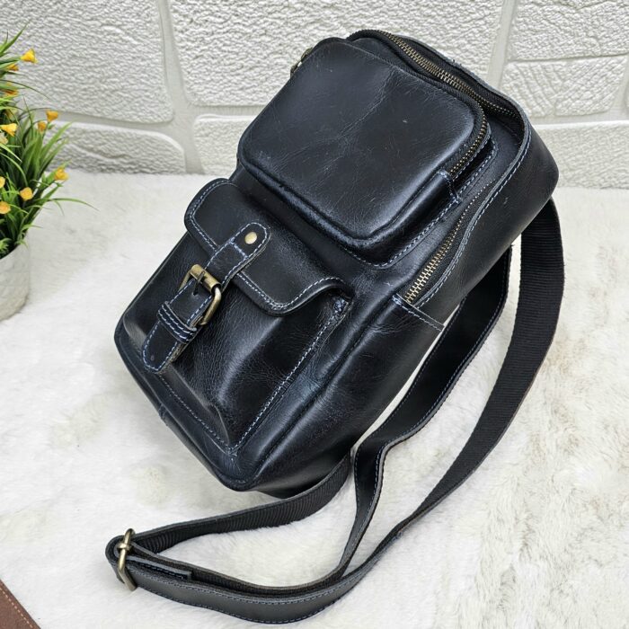 Handmade leather crossbody bag with vintage design and multiple pockets
