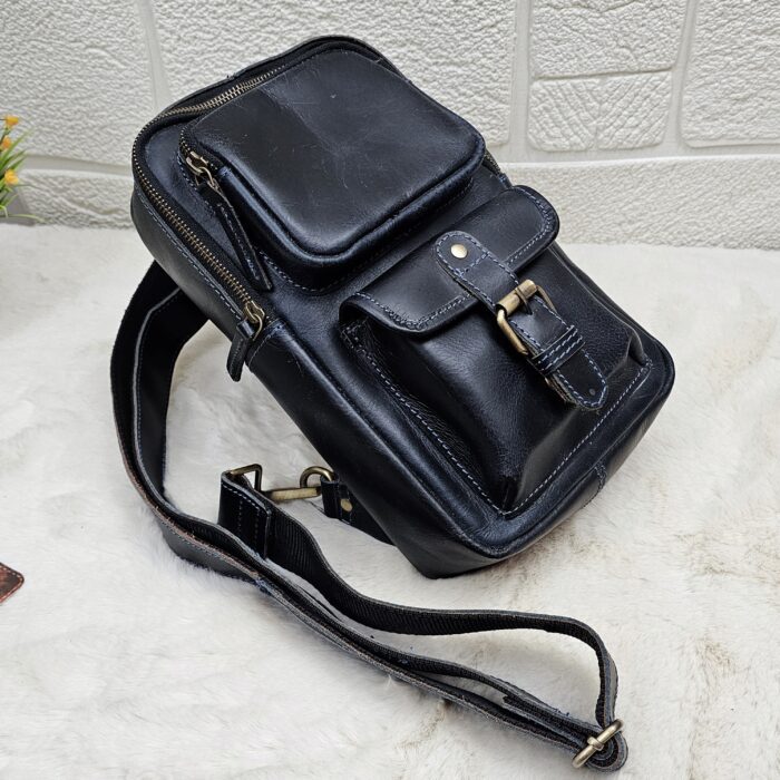 Handmade leather crossbody bag with vintage design and multiple pockets