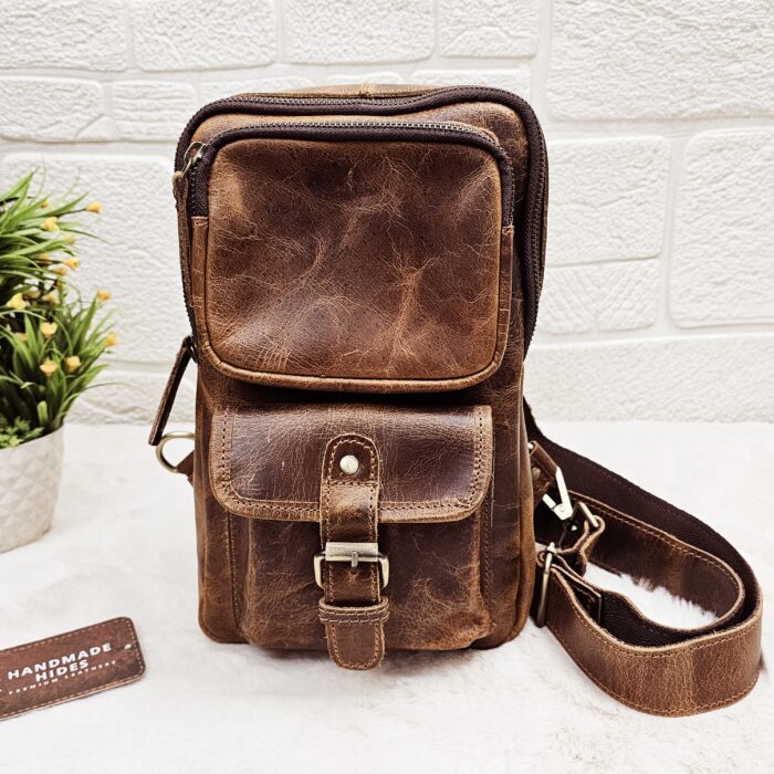 Handmade leather crossbody bag with vintage design and multiple pockets