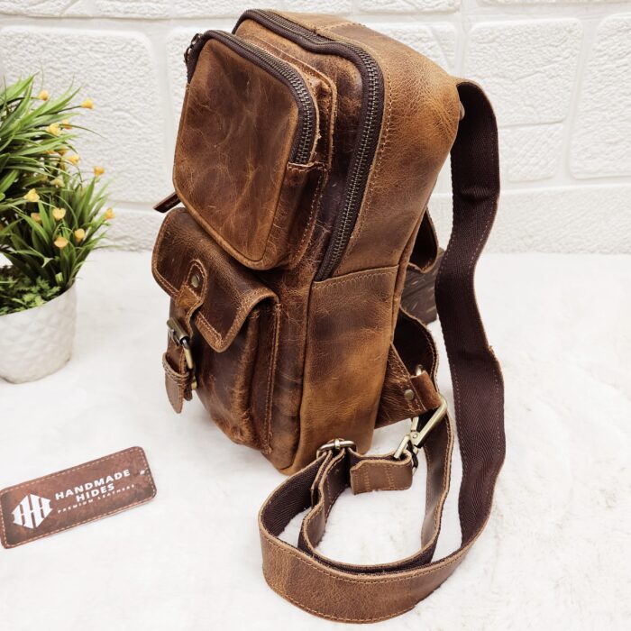 Handmade leather crossbody bag with vintage design and multiple pockets