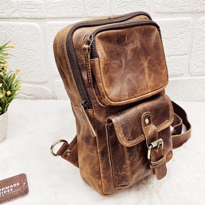 Handmade leather crossbody bag with vintage design and multiple pockets