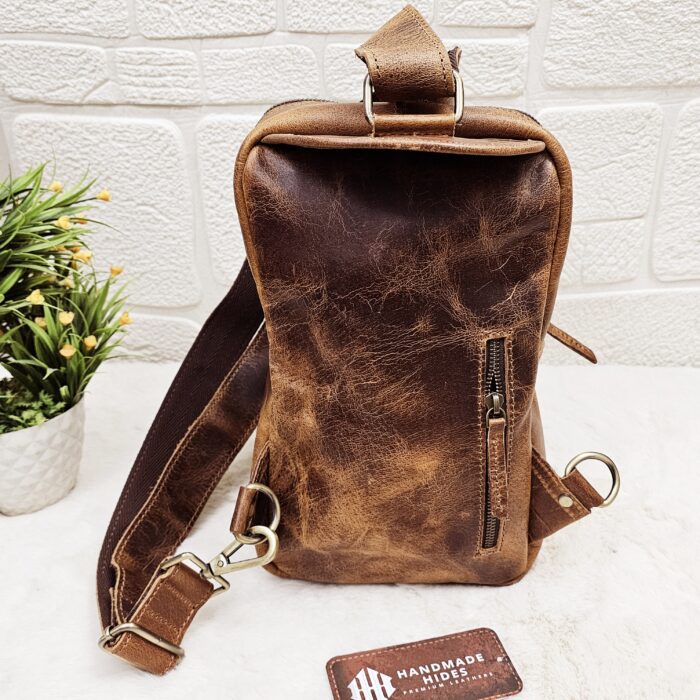 Handmade leather crossbody bag with vintage design and multiple pockets