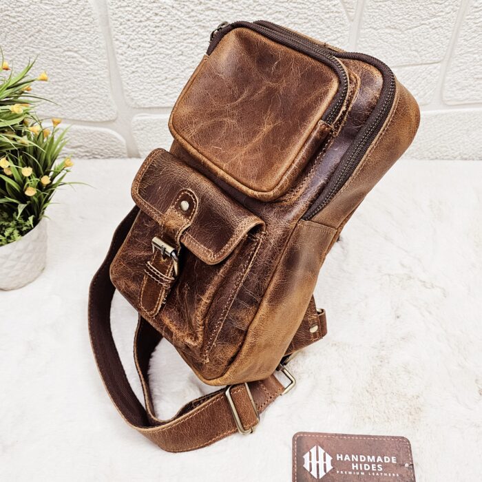 Handmade leather crossbody bag with vintage design and multiple pockets